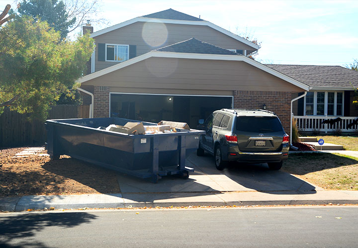 Roll-off dumpster placed at a suburban American home